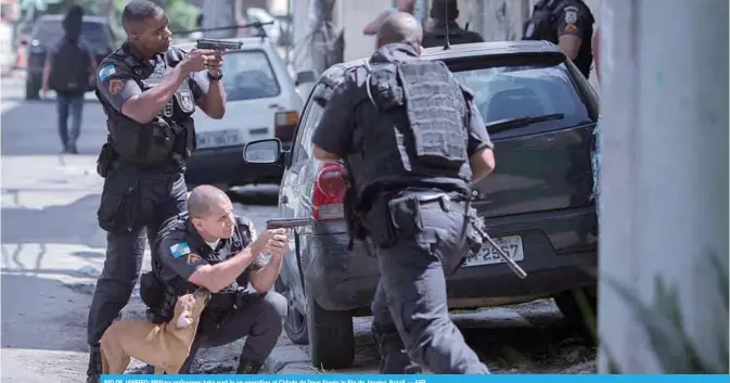  ?? —AFP ?? RIO DE JANEIRO: Military policemen take part in an operation at Cidade de Deus favela in Rio de Janeiro, Brazil.