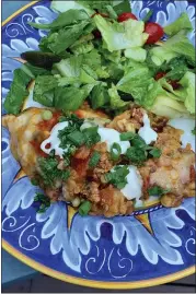  ?? COURTESY OF BIBBY GIGNILLIAT ?? This crowd-pleasing Mexican “lasagna” layers chicken, black beans, chipotle chiles and adobo sauce with corn tortillas for a dish that will serve a crowd.