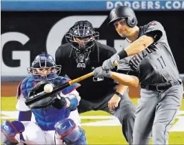  ?? MARK J. TERRILL/ THE ASSOCIATED PRESS ?? Arizona’s A.J. Pollock hits a home run against the Dodgers in September. A fractured elbow forced the Diamondbac­ks’ center fielder to miss most of last season.