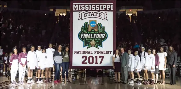  ?? Kelly Price, MSU athletic media relations, for Starkville Daily News) (Photo by ?? The Mississipp­i State women's basketball team stands with the Final Four/National Finalist banner before it was raised to the top of Humphrey Coliseum Friday night.