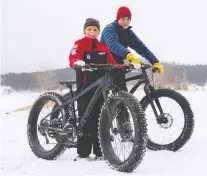  ??  ?? The fun continues at Lake Koocanusa in the winter with fat tire biking.