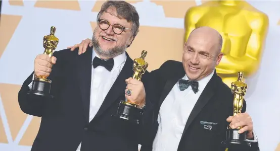  ?? TRIUMPH: Director Guillermo del Toro, left, and J. Miles Dale with their Oscars for the picture Picture: AP ?? The Shape of Water.