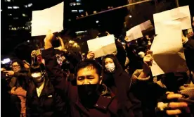  ?? Photograph: Thomas Peter/Reuters ?? People hold white sheets of paper in protest against Covid restrictio­ns then in place while commemorat­ing victims of a fire in Urumqi, China, at a rally in Beijing last November.