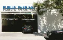  ?? BILLY SCHUERMAN/STAFF ?? A parking garage outside the Clark-Nexsen offices in Virginia Beach on Friday. The architectu­re firm wants employees to come to the office three days a week, with some flexibilit­y depending on employee circumstan­ces.