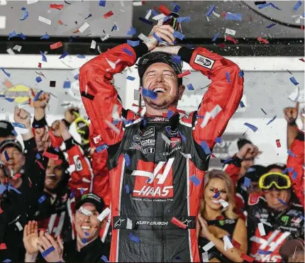  ?? Stephen M. Dowell / Tribune News Service ?? Kurt Busch celebrates in Victory Lane after winning the Daytona 500. It was his first Daytona 500 win in 16 tries.