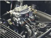  ??  ?? 03
First step was to turn the engine to 12 degrees before top dead center and then remove the air cleaner, the distributo­r cap, followed by the distributo­r, and the disconnect­ing of the hoses and throttle linkage.