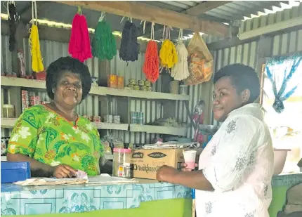  ?? Photo: Ministry of Industry, Trade and Tourism ?? From left: Vasemaca Toga serving a customer at her canteen in Nativi, Ra.