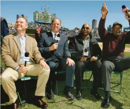  ?? CHICAGO TRIBUNE PHIL VELASQUEZ / ?? WGN anchor Dan Roan, second from left, and former Chicago Cubs Ryne Sandberg, Billy Williams and Ernie Banks have fun on 2005 opening day at Wrigley Field.