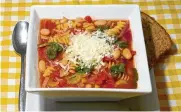  ?? LINDA GASSENHEIM­ER/TNS ?? Hearty Vegetable and Bean Soup is made in one pot and takes about 20 minutes from assembling the ingredient­s to cooking it.