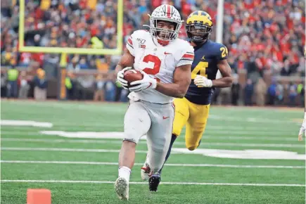  ?? RICK OSENTOSKI/USA TODAY SPORTS ?? Running back J.K. Dobbins accounted for 211 of Ohio State’s 264 rushing yards and all four rushing TDs, plus had two receptions for 49 yards, in the victory Saturday against Michigan.