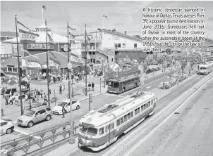  ??  ?? A historic streetcar painted in honour of Dallas,Texas, passes Pier 39, a popular tourist destinatio­n, in June 2016. Streetcars fell out of favour in most of the country after the automobile boom of the 1950s, but the city by the bay still uses them.