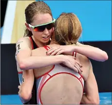  ??  ?? CONSOLING HUG: Holland (left) and Stanford embrace at the end