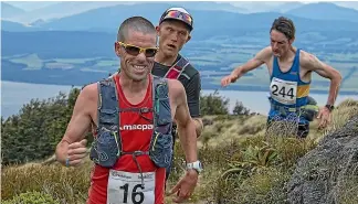  ?? BARRY HARCOURT ?? Vajin Armstrong, from Christchur­ch, leads Weston Hall and Lennox Hannan during the Kepler Challenge at Te Anau last year.