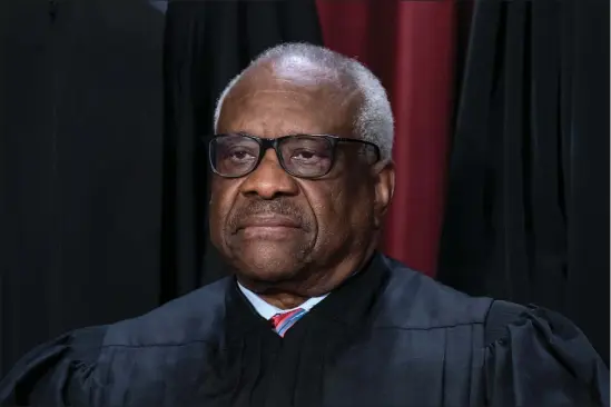  ?? J. SCOTT APPLEWHITE, FILE — THE ASSOCIATED PRESS ?? Associate Justice Clarence Thomas poses with other members of the Supreme Court for a new group portrait, at the Supreme Court building in Washington in October. Thomas has for more than two decades accepted luxury trips nearly every year from Republican megadonor Harlan Crow without reporting them on financial disclosure forms, ProPublica reports.