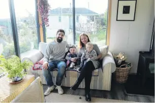  ??  ?? English teacher Isaac Hensman and nutritioni­st Chloe Ritchie, pictured with their children, Ida and River, say they were drawn to the clean, simple lines of Japanese and Scandinavi­an interiors.