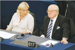  ??  ?? STRASBOURG: In this July 14, 2009 file photo Jean-Marie Le Pen, right, and his daughter Marine Le Pen sit at the European Parliament. — AP