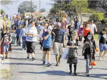  ?? Picture: SUPPLIED ?? FIGHTING CRIME: Rosemount residents were able to have a Halloween trick or treat parade in the streets of the suburbs thanks to the Community Policing Forum