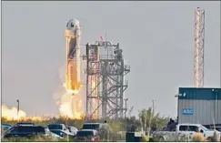  ?? Tony Gutierrez Associated Press ?? BLUE ORIGIN’S New Shepard rocket launches from a spaceport north of Van Horn, Texas. It carried Jeff Bezos and three other passengers.