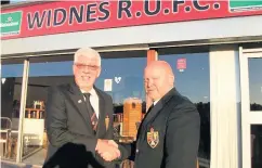  ??  ?? Outgoing president Stephen Morris ( left) hands over the reins to new Widnes RUFC president Ged Snee.