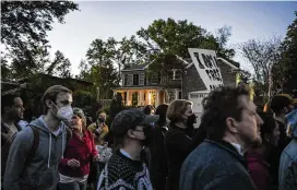  ?? KENNY HOLSTON/THE NEW YORK TIMES ?? Demonstrat­ors march to Justice Samuel Alito’s house for a vigil as part of an abortion rights protest, in Alexandria, Va., on May 9. The demonstrat­ions outside Supreme Court justices’ homes have sparked a debate over what counts as appropriat­e forms of protest in a deeply polarized country.