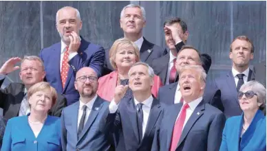  ??  ?? (First row L-R) German Chancellor Angela Merkel, Belgium’s Prime Minister Charles Michel, Nato Secretary-general Jens Stoltenber­g, US President Donald Trump, Britain’s Prime Minister Theresa May (second row L-R) Denmark’s Prime Minister Lars Lokke...