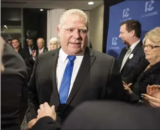  ?? The Canadian Press ?? Doug Ford greets the media after being named as the newly elected leader of the Ontario Progressiv­e Conservati­ves at the delayed Ontario PC Leadership announceme­nt in Markham, Ont., on Saturday.