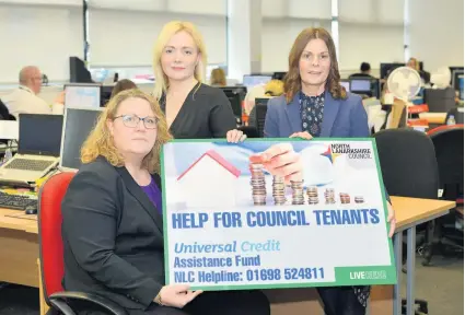  ??  ?? Extra cash Councillor Brannan-mcvey (seated) with members of the rents team