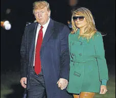  ?? AP ?? US President Donald Trump and first lady Melania Trump arrive in the White House after returning from Iraq on Thursday.