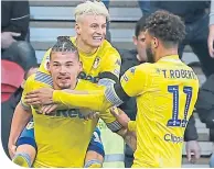  ??  ?? Kalvin Phillips, left, celebrates his late equaliser