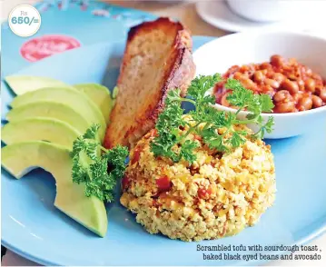  ??  ?? Rs 650/= Scrambled tofu with sourdough toast , baked black eyed beans and avocado