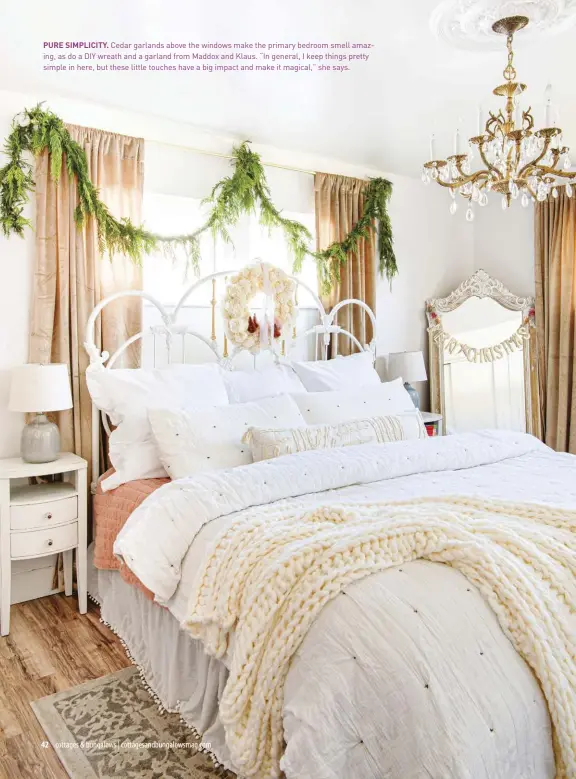  ?? ?? PURE SIMPLICITY. Cedar garlands above the windows make the primary bedroom smell amazing, as do a DIY wreath and a garland from Maddox and Klaus. “In general, I keep things pretty simple in here, but these little touches have a big impact and make it magical,” she says.