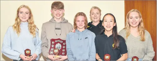  ?? ?? Torpedo Squad swimmers with coach Joann Baker, at the recent Fermoy Swimming Club AGM and awards night - Margaret Verling (most improved), Zach Daniels-Howard (Swimmer of the Year), Amy Hawe (outstandin­g achievemen­t), Lucia Miao (dedication and attendance) and Grace Duggan (dedication and commitment).