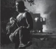  ?? BEN ROTHSTEIN, 20TH CENTURY FOX ?? Logan (Hugh Jackman) tries to protect the young mutant Laura (Dafne Keen) in a scene from the movie, “Logan.”