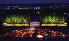  ??  ?? Spectators in their vehicle attend a drive-in movie screening of Hippocrate­s by French director Thomas Lilti, on Place des Quinconces in Bordeaux , as part of the Drive-in Festival.—AFP