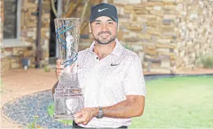  ?? AFP ?? Jason Day poses with the AT&T Byron Nelson trophy.