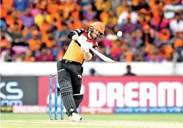  ?? - AFP photo ?? Sunrisers Hyderabad cricketer David Warner plays a shot during the 2019 Indian Premier League (IPL) Twenty20 cricket match between Sunrisers Hyderabad and Kolkata Knight Riders.