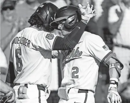  ?? MCKENZIE LANGE/USA TODAY NETWORK ?? Clemson’s Nolan Nawrocki (2) and Jacob Hinderleid­er (6) celebrate during a game earlier this season.