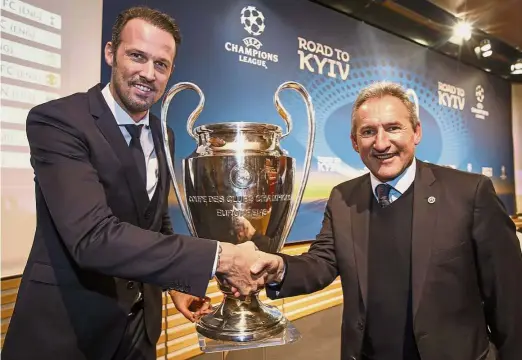  ??  ?? Great to be here: Sports director of Basel Marco Stroller (left) shaking hands with Manchester City’s director of football Txiki Bergirista­in ahead of the Champions League last-16 draw in Nyon, Switzerlan­d, yesterday. — AP