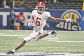  ?? BRYNN ANDERSON/ASSOCIATED PRESS ?? Alabama wide receiver DeVonta Smith runs against Florida during the Southeaste­rn Conference championsh­ip Dec. 19 in Atlanta. Smith, along with five other Alabama players, were selected for the Associated Press All-America team.