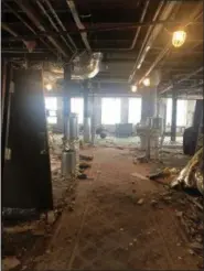  ?? BRIANA CONTRERAS — THE MORNING JOURNAL ?? This view shows the fourth floor of the Broadway Building from the doorway of the stairwell. It will become an event space when the building is renovated to become the new Ariel Broadway Hotel at 301 Broadway, Lorain.