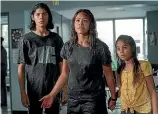  ??  ?? Gina Rodriguez, centre, is determined to keep her children, Lucius Hoyos, left, and Ariana Greenblatt.