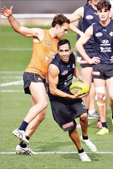  ?? AFP ?? Aussie Rules Football is known for its raucous crowds, who sometimes sling racist insults from the stands. Carlton player Eddie Betts (centre) has been the recepient of those attacks during his 16-year career.