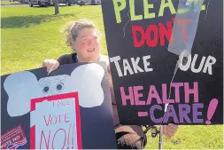  ?? MIKE CATALINI/ASSOCIATED PRESS ?? Laurel Smith, of Medford, N.J., attends a protest Friday outside the office of Rep. Tom MacArthur, R-N.J., in Marlton, N.J. Smith is concerned about insurance coverage for her grown son, who has mitochondr­ial disease.