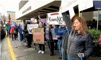  ?? AP ?? Molly Knight, right, takes part in a demonstrat­ion objecting to the nomination of Brett Kavanaugh for US Supreme Court justice rally outside the office of Senator Lisa Murkowski, R-alaska.