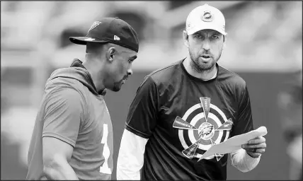  ?? TIM TAI / THE PHILADELPH­IA INQUIRER VIA AP POOL ?? Philadelph­ia Eagles quarterbac­k Jalen Hurts, left, stands with offensive coordinato­r Shane Steichen during a summer practice in 2021 at Lincoln Financial Field in Philadelph­ia. Steichen is a UNLV alumnus, recruited to the Scarlet and Gray by the legendary John Robinson.