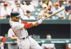  ?? Patrick Semansky / Associated Press ?? The Boston Red Sox’s Mookie Betts hits a solo home run in the third inning against the Orioles on Wednesday.