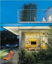  ??  ?? A green roof deck off the master bedroom upstairs is planted with native grasses.