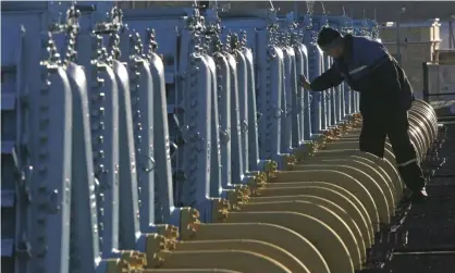  ?? ?? A worker at a gas compressor station of the Yamal-Europe pipeline near Nesvizh, south-west of Minsk, Belarus. Photograph: Sergei Grits/ AP