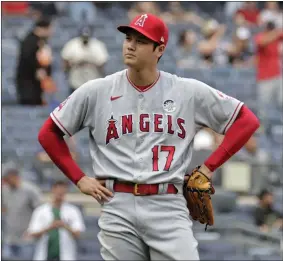  ?? AP ?? Los Angeles Angels pitcher Shohei Ohtani reacts after giving up a home run to New York Yankees’ Gleyber Torres during the first inning of the first game of a doublehead­er Thursday.
