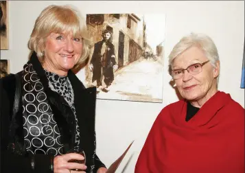  ??  ?? Marian Campbell and Marge McDonald at the launch of the exhibition by artist Eamonn Carter ‘Lest We Forget Krakow 1939-1945’ in Gorey Library.